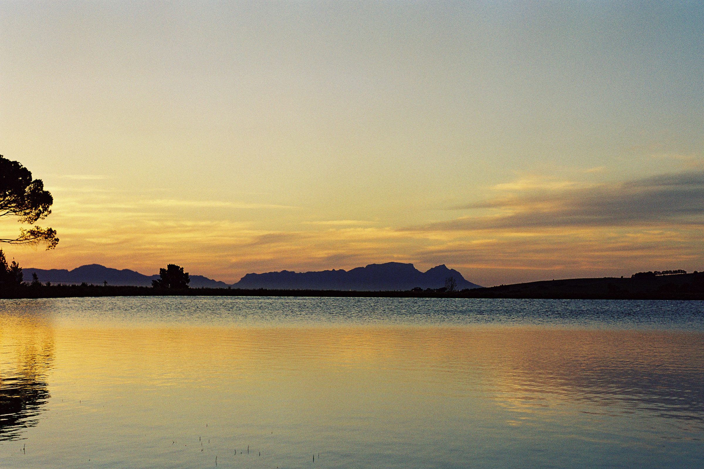 Sunset over a dam at Eendrag, with the Hottentots Holland mountains beyond